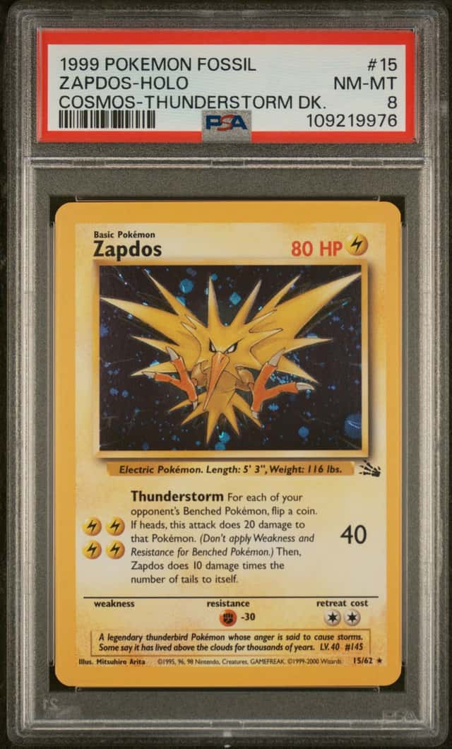 1999 Pokémon TCG Fossil Zapdos 15/62 Cosmos Holo Rare PSA 8 WOTC