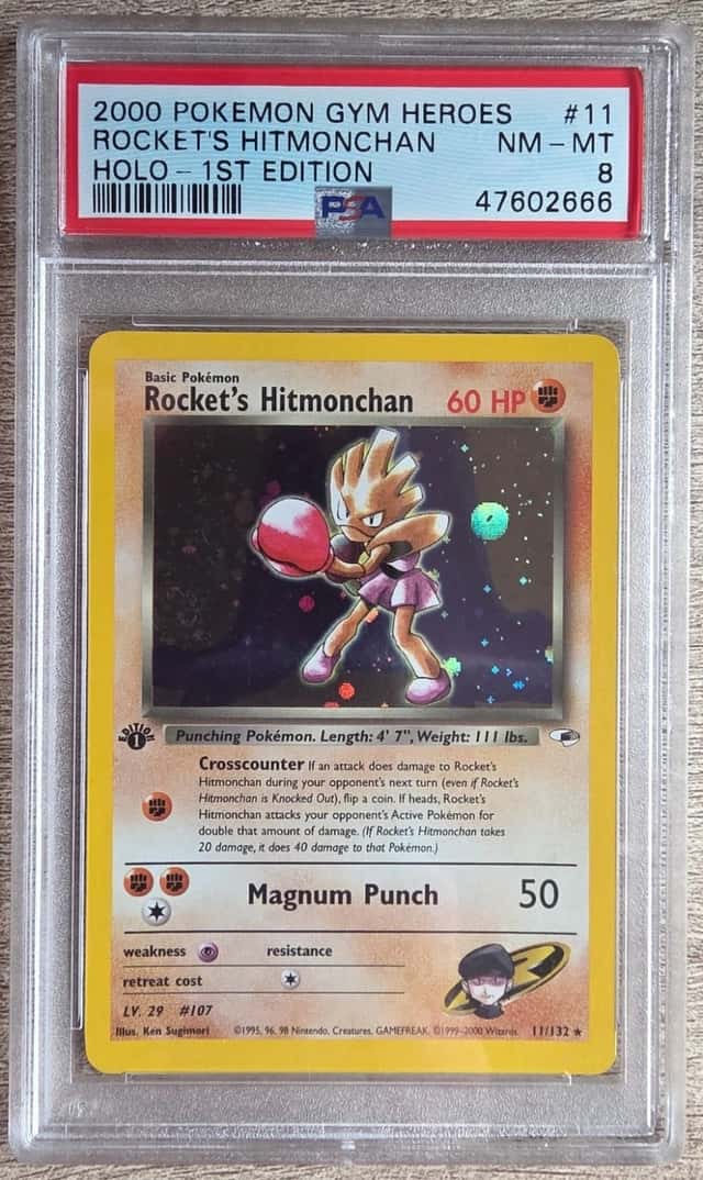 Rocket's Hitmonchan 11/132 Gym Heroes 1st Edition Holo Pokemon PSA 8 NM-MT