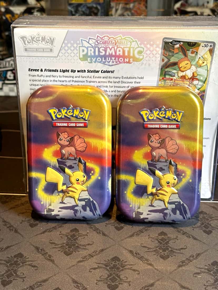prismatic evolutions tin